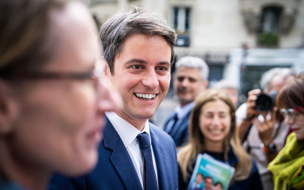 Gabriel Attal (C), french prime minister, during the Prime Minister s visit to support the candidacy of Ensemble, party of the presidential majority, in the 11th constituency of Paris, in the context of the second round of the 2024 legislative elections, against the new popular front, on the Raspail market, in Paris, FRANCE, 05 July 2024. (Photo by Xose Bouzas / Hans Lucas / Hans Lucas via AFP)
