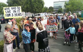 Protestors outside the Southern Response offices.
