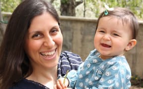 (FILES) In this file handout photo released by the Free Nazanin campaign in London on June 10, 2016 shows Nazanin Zaghari-Ratcliffe (L) posing for a photograph with her daughter Gabriella.
