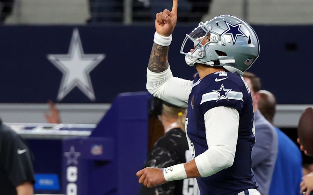 Quarterback Dak Prescott #4 of the Dallas Cowboys celebrates after a touchdown.