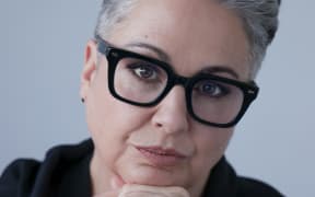 This is a close up headshot of Victoria Kelly. She is wearing a pair of black glasses and looking at the camera.
