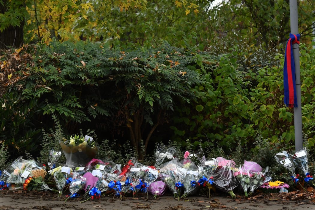Floral tributes are seen near the scene of a derailed tram in Croydon, south of London. Seven people were killed and around 50 injured  when a London tram came off the tracks and tipped over on November 9, 2016.
