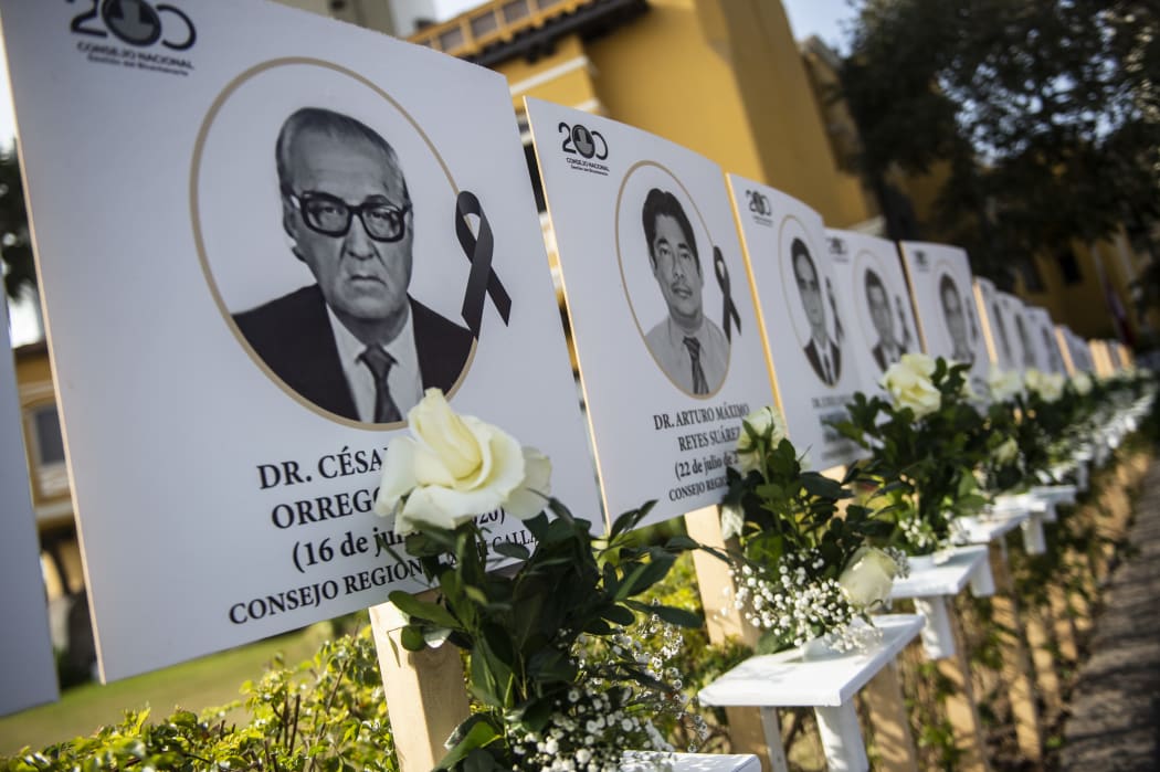 Images of the 125 doctors who have died during the Covid-19 pandemic in Peru, are displayed in Lima.