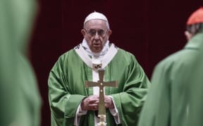 Pope Francis attends a service during the last day of a global child protection summit at the Vatican.