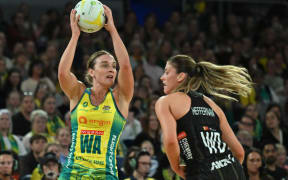 Liz Watson of Australia (left) in action during the first test match of the Constellation Cup series between the Australian Diamonds and the New Zealand Silver Ferns.
