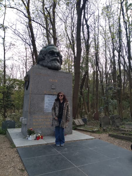 Mariana Enriquez at the Karl Marx grave, Highgate Cemetery, London.