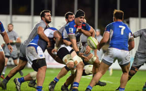 Kane Le'aupepe offloads during Manu Samoa's test against Georgia in November.