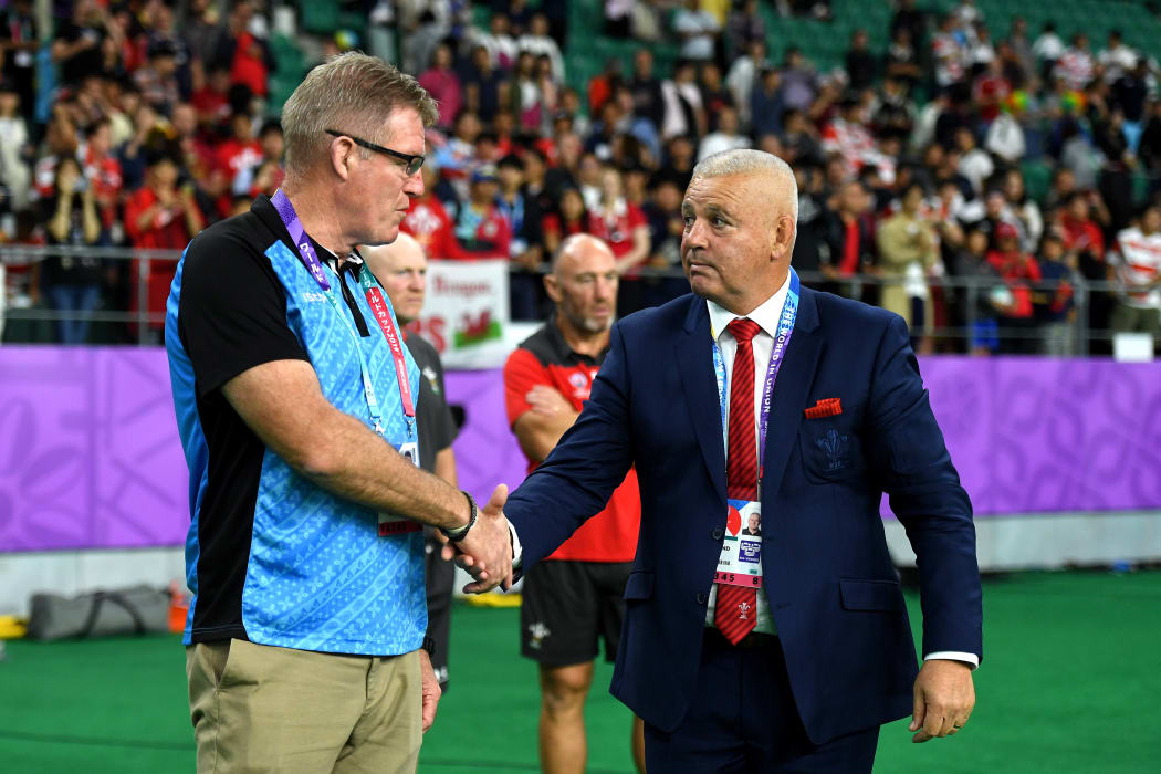 Fiji coach John McKee and Wales coach Warren Gatland shake hands after the final whistle.