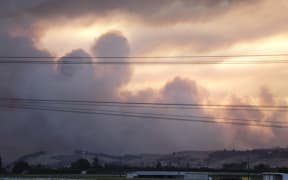 The sun setting over Nelson as the fire rages on.