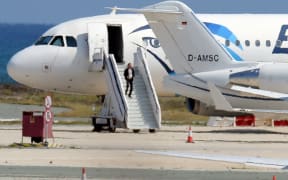 A man believed to be the hijacker of the EgyptAir Airbus A-320, which was diverted to Cyprus, leaves the plane before surrendering to security forces after a six-hour standoff.