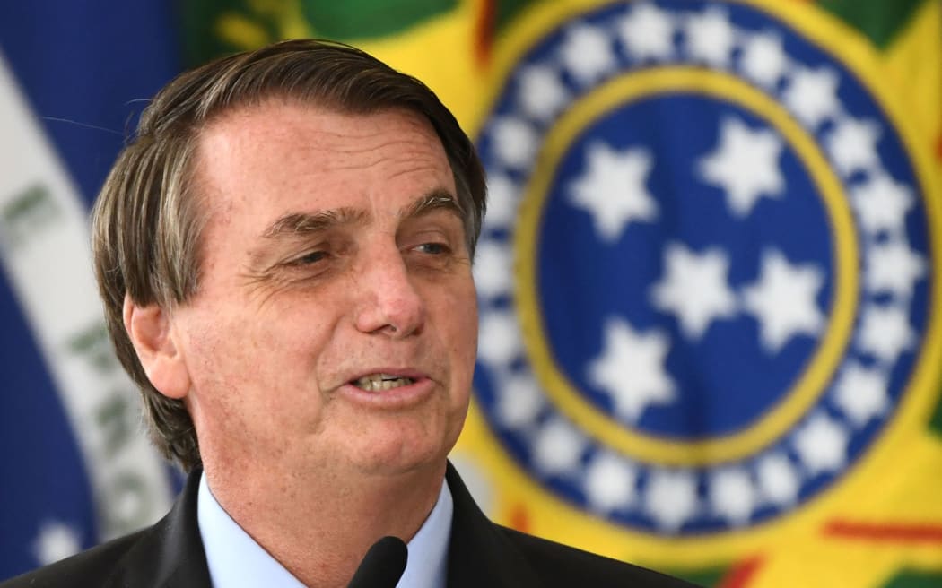 Brazilian President Jair Bolsonaro delivers a speech during the launching of the Brazilian Waters Program in celebration of International Water Day at Planalto Palace in Brasilia, on March 22, 2021.