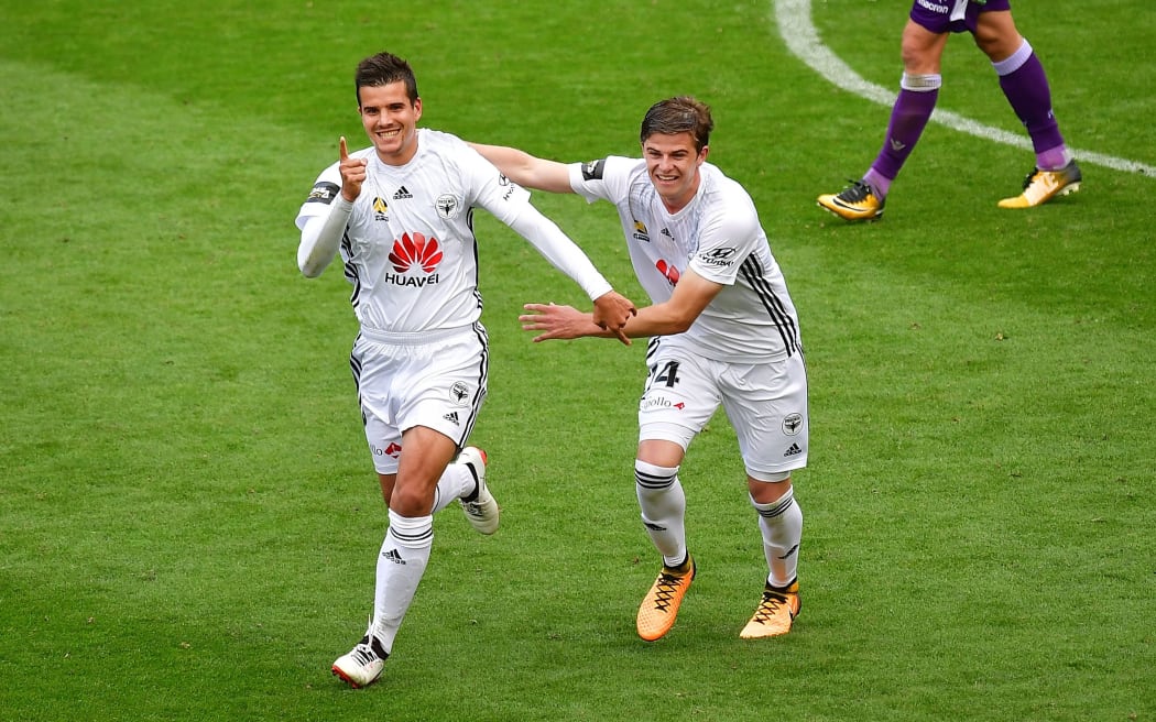 Phoenix's  Andrija Kaluderovic (L) celebrates scoring a goal with team mate Alex Rufer during the A-League - Phoenix v Perth Glory.