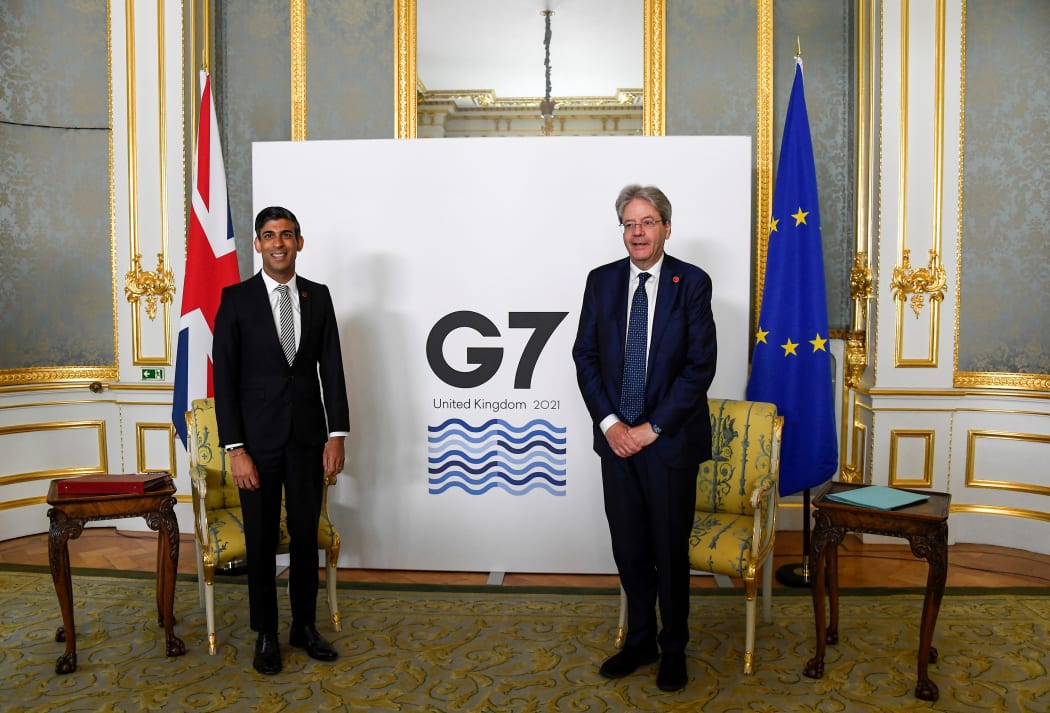Britain's Chancellor of the Exchequer Rishi Sunak (L) and European Commissioner for Economy Paolo Gentiloni pose for a photograph on the second day of the G7 Finance Ministers Meeting.