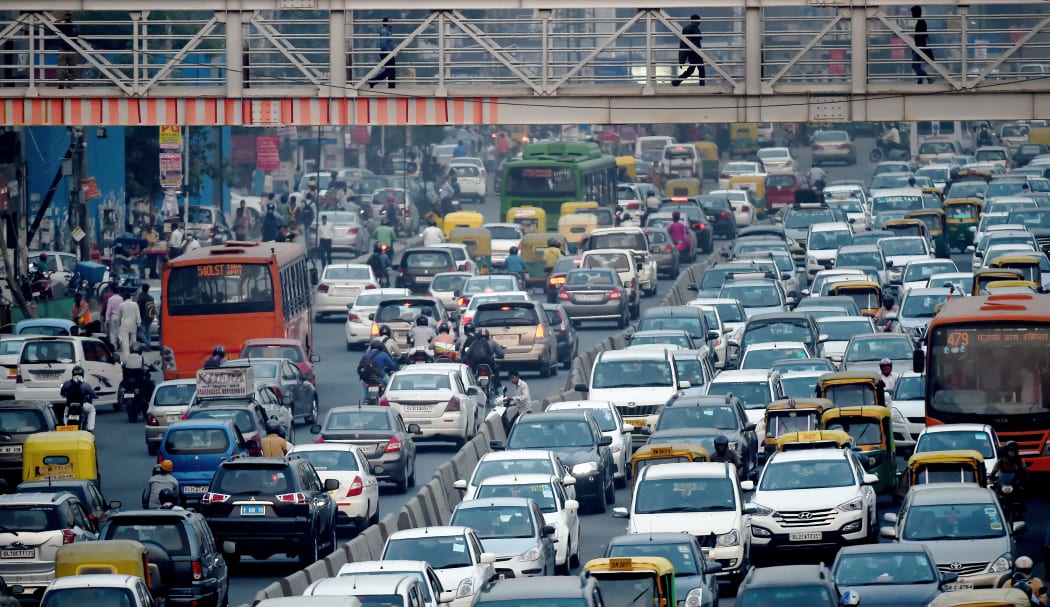 Commuters in their vehicles clog the roads of New Delhi.