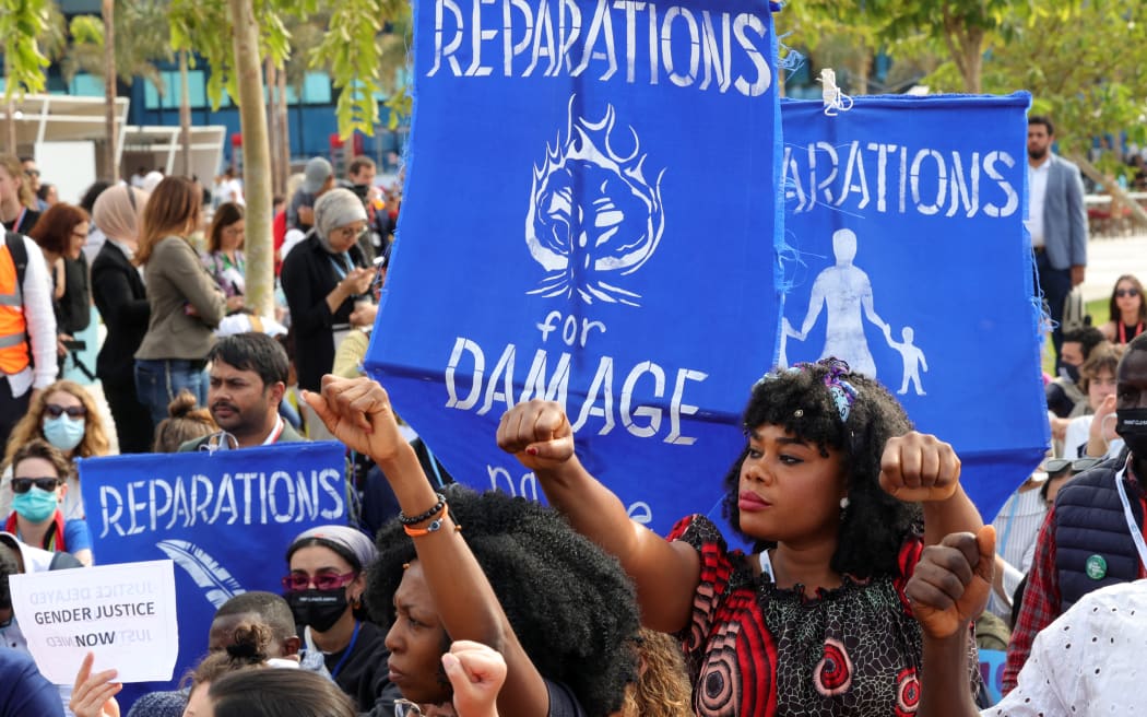 Climate activists demonstrate at the Sharm el-Sheikh International Convention Centre, in Egypt's Red Sea resort city of the same name, during the COP27 climate conference on November 17, 2022.