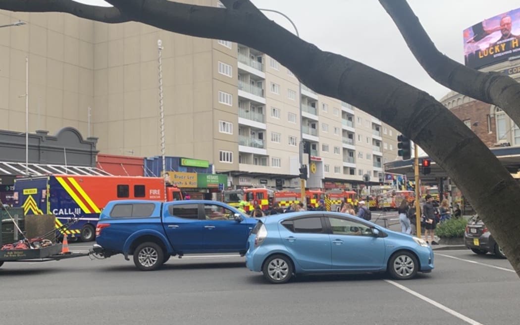 Multiple fire trucks have responded to a fire in Auckland's Newmarket that caused the Newmarket Train Station to evacuate and interrupted train services.