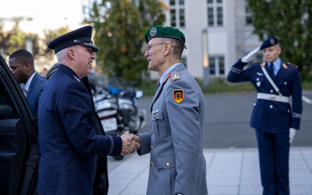 U.S. Space Force Gen. Stephen N. Whiting, U.S. Space Command commander and Multinational Force-Operation Olympic Defender commander, greets German Ministry of Defence Director-General for Military Strategy and Operations Lt. Gen. Gunter Schneider during a formal accessions ceremony in Berlin, Germany, Oct. 14, 2024. The multinational named operation represents a growing commitment among the closest allies in space to jointly strengthen defenses and deter aggression, ensuring space remains a domain that benefits all of humanity. (Courtesy photo)
