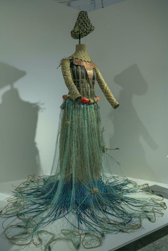 Otintaai, meaning sunrise, is a costume created for a female Kiribati warrior facing rising sea levels caused by climate change, overfishing and plastic pollution.