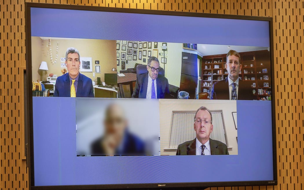 12 December 2023 Peter Meecham/The Press International medical experts, pictured from top left: Dr Andrew Baker, Dr Andre Campbell, top middle, Prof John Hick, top right, Prof Guy Rutty, bottom Left, and Prof Charles Deacon, bottom right, appear over audio visual link during the coronial inquest into the 2019 Christchurch mosque attacks held at the Christchurch high Court.