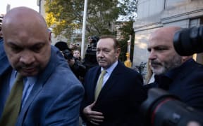 US actor Kevin Spacey, centre. leaves United States District Court for the Southern District of New York on 20 October, 2022 in New York City.