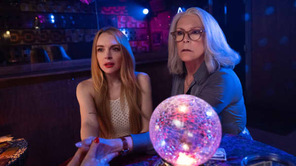 Lindsay Lohan and Jamie Lee Curtis at a fortuneteller in the Disney film Freakier Friday.