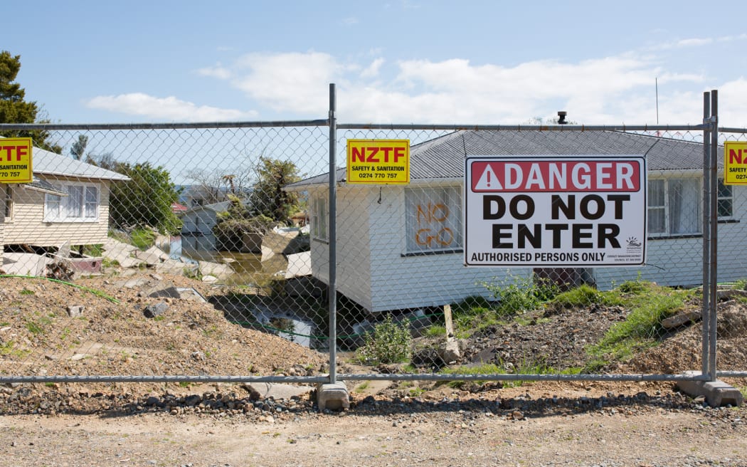 Houses on College Rd are still fenced off and uninhabitable