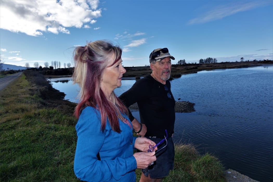 Rose and Russell Scott where the tide flows near their home near the Motueka Estuary.