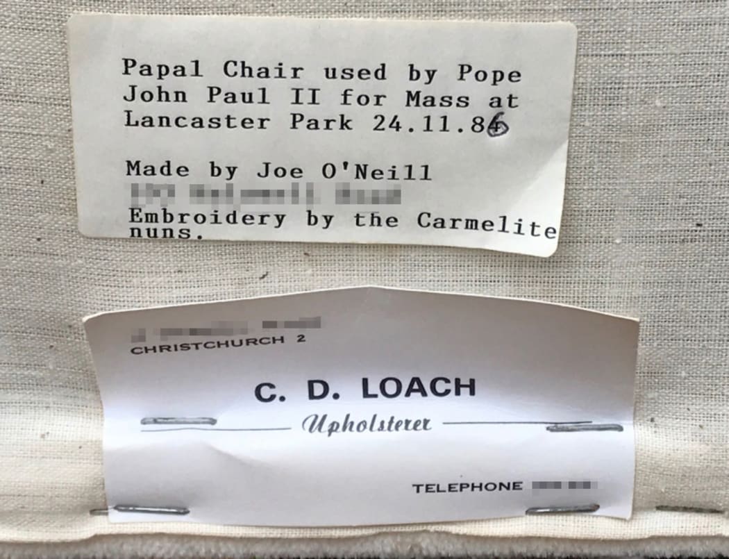 Labels certifying the work of Joe O'Neill and Colin Loach, attached to the underside of the the Papal chair.