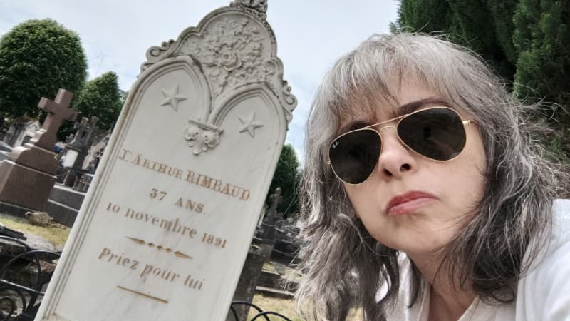 Mariana Enriquez at the grave of poet Arthur Rimbaud in Charleville, France.