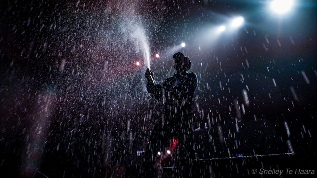 Wu-Tang Clan pour champagne over the crowd at Auckland's Trusts Arena