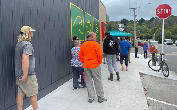 Queues for community supermarkets and petrol stations in Gisborne extended down the street on Wednesday afternoon.
