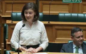 Green MP Chlöe Swarbrick speaking in parliament and responding to heckling with 'okay, Boomer'.