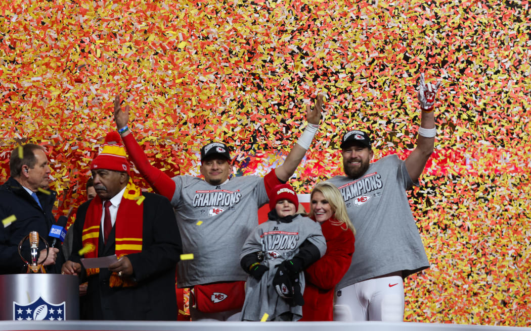 Kansas City Chiefs quarterback Patrick Mahomes (L) and tight end Travis Kelce (R) celebrate after winning the AFC Championship game against the Buffalo Bills.
