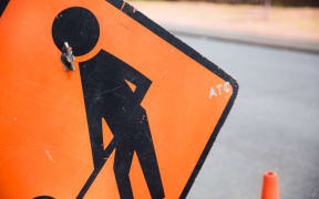 Close up of a road works sign