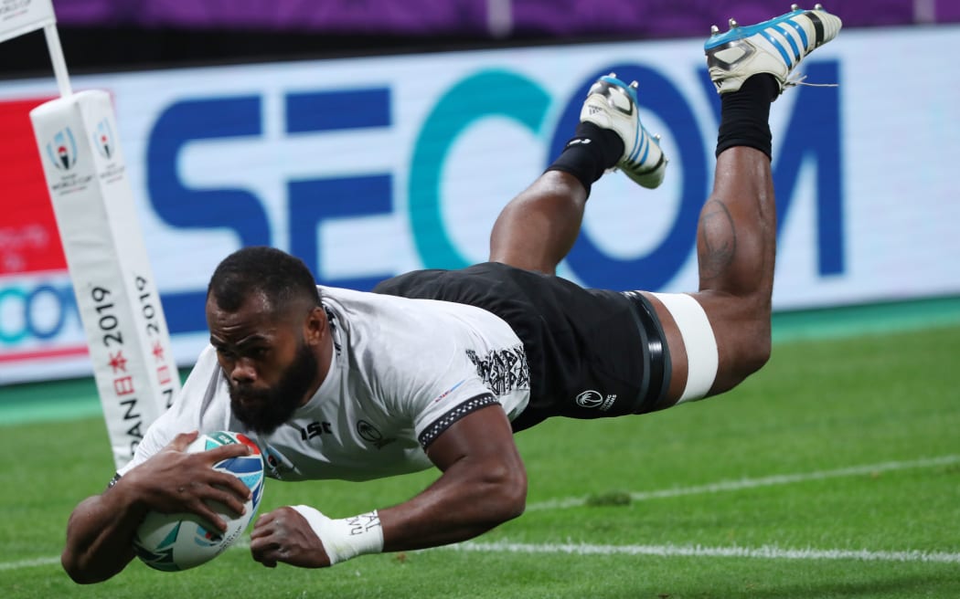 Peceli Yato scores the game's first try during the first half of the match.