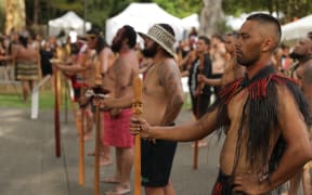 Tangata whenua welcome politicians to the Treaty Grounds at Waitangi.