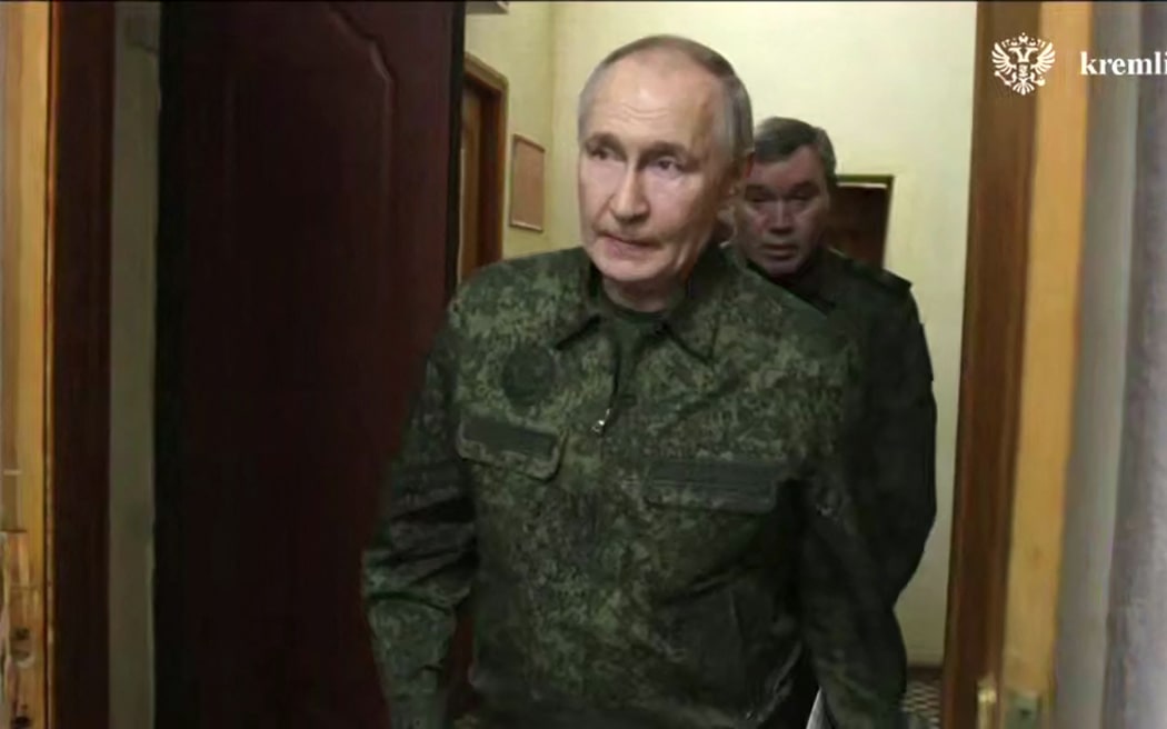 In this grab taken from a handout footage released by the Kremlin on March 12, 2025, Russia's President Vladimir Putin visits a command point for the Kursk group of troops involved in the counteroffensive in the Kursk region, amid the ongoing Russian-Ukrainian conflict. (Photo by Handout / KREMLIN.RU / AFP) / RESTRICTED TO EDITORIAL USE - MANDATORY CREDIT "AFP PHOTO / KREMLIN.RU / HANDOUT" - NO MARKETING NO ADVERTISING CAMPAIGNS - DISTRIBUTED AS A SERVICE TO CLIENTS