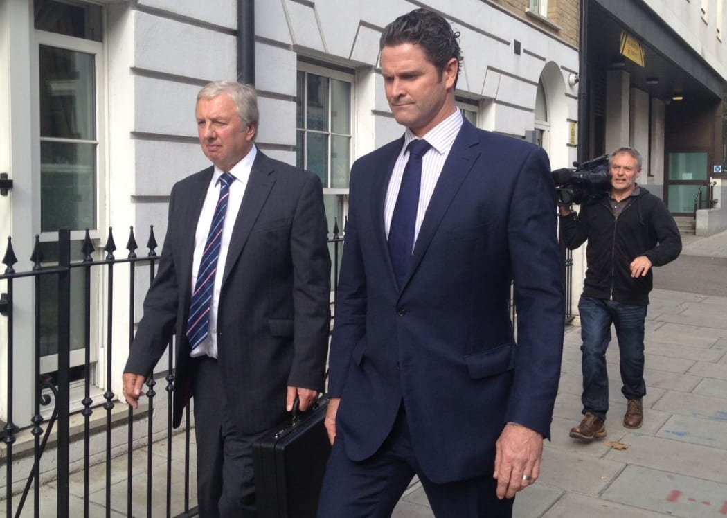 Chris Cairns (right) and his lawyer Colin Nott leave Westminster Magistrates' Court after an earlier hearing.