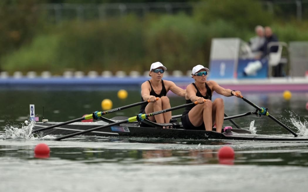 New Zealand's Brooke Francis (L) and New Zealand's Lucy Spoors compete in the women's double sculls heats rowing competition at Vaires-sur-Marne Nautical Centre in Vaires-sur-Marne during the Paris 2024 Olympic Games on July 27, 2024. (Photo by Bertrand GUAY / AFP)