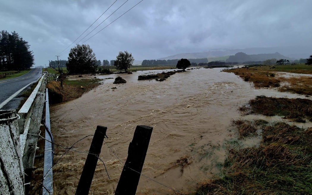 A creek has burst in banks on Lake Ferry Road south of Martinborough, Wairarapa.