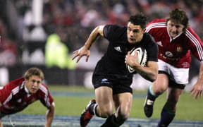 All Black Dan Carter slips the tackle of Jonny Wilkinson during the 1st test match between the New Zealand All Blacks and the British and Irish Lions at Jade Stadium in Christchurch,New Zealand in June, 2005. The All Blacks won 21-3.