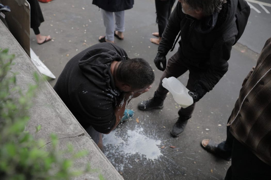 Milk poured over a protester.