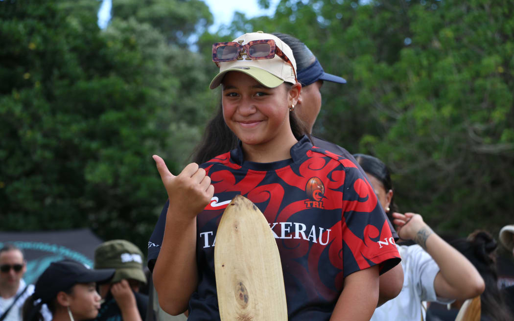 A young kaihoe with Te Korowai-Ngā Waka o Te Tai Tokerau at Waitangi 2025.