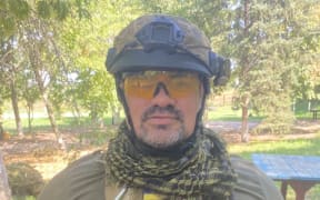 A man wearing military gear
