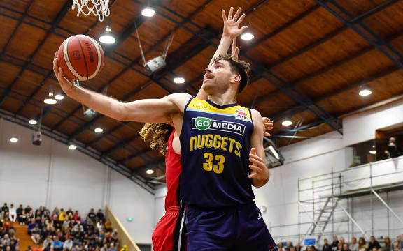 Sam Timmins of the Nuggets shoots during the NBL basketball match, Rams V Nuggets at Cowles Stadium, Christchurch, New Zealand, 10th June 2021.