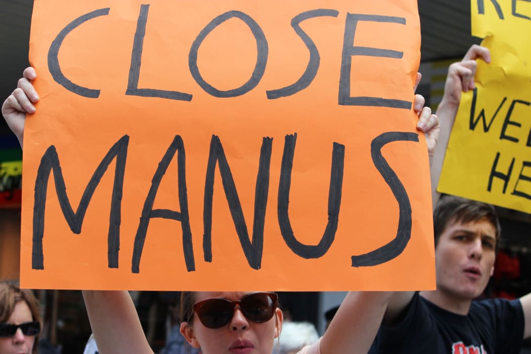 Refugee advocates protest in Manly against Australia's treatment of refugees, on 22 February 2014.
