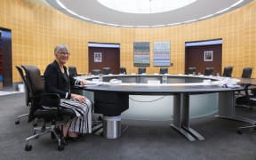 Secretary of Cabinet, Rachel Hayward sits in her chair next to the Prime Minister's place at the cabinet table.