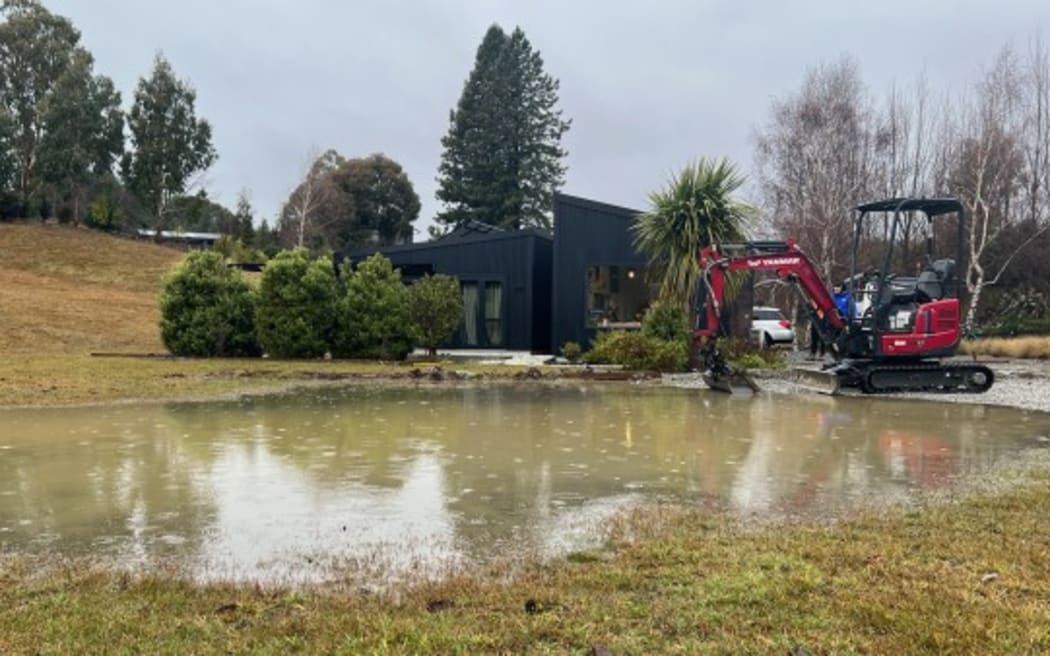 A resident on Wineberry Lane called in a mate's digger as water flooded his property Monday morning.