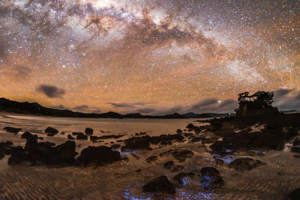 Milky Way with sea and beach in the foreground