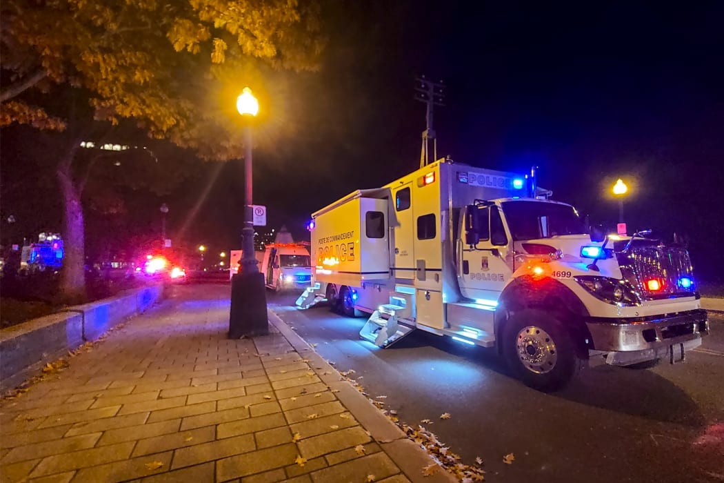 A police truck parked near the National Assembly of Quebec, in Quebec City, early on 1 November, 2020, after two people were killed and five wounded ina sword attack.